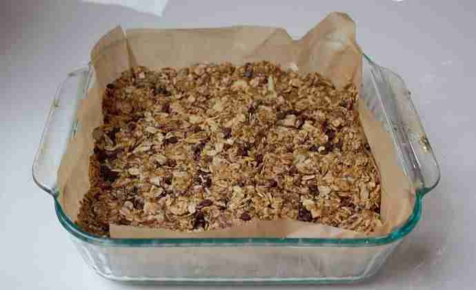Homemade healthy granola bars against white background