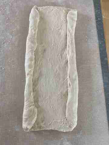 rolled out dough with long sides folded in